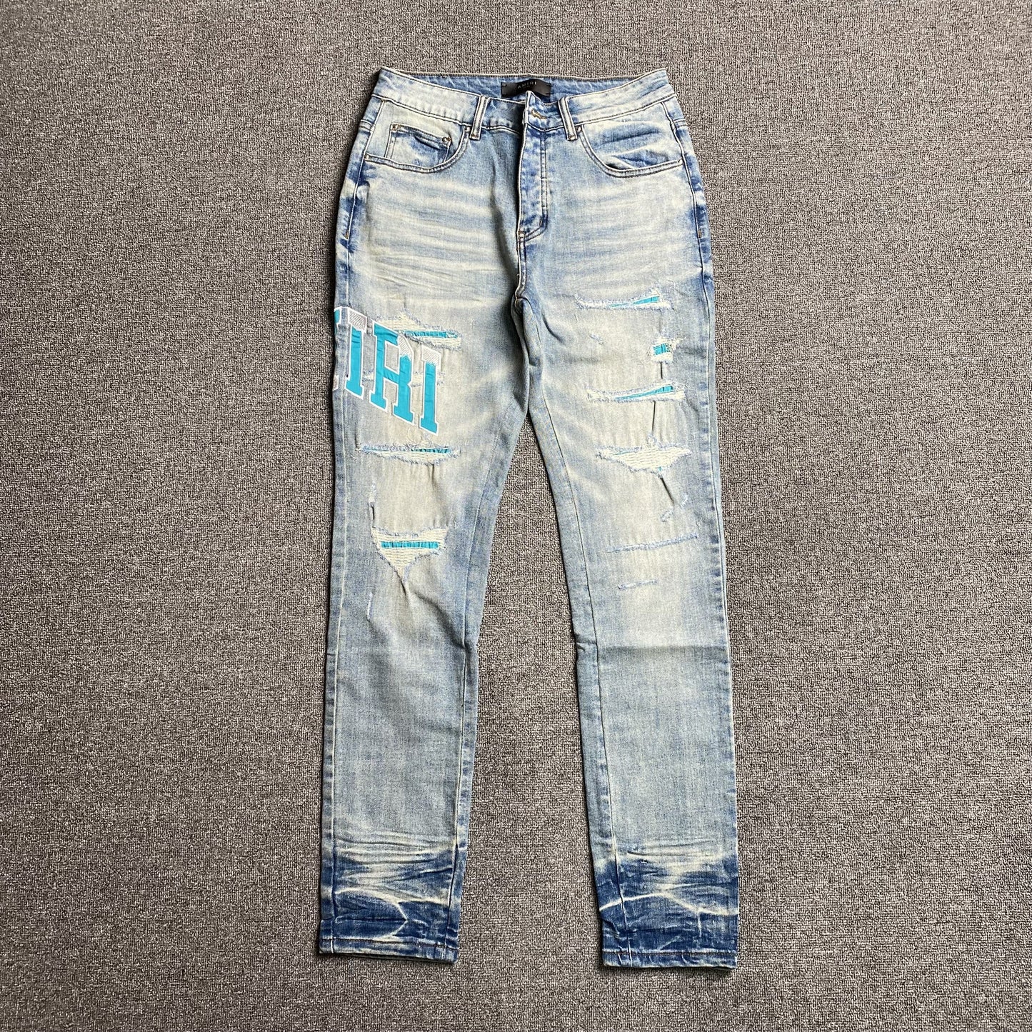 AMIRI VARSITY LOGO JEANS