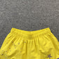 SP5DER DOUBLE LAYER SHORTS YELLOW